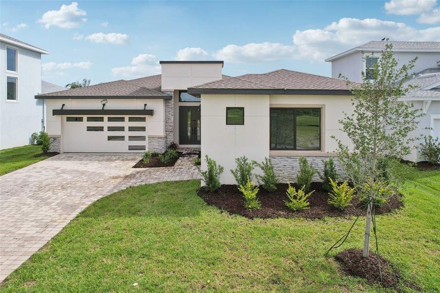 Front exterior of a new home in Biscayne Landing at Seaire, Parrish, FL, highlighting curb appeal (Image 25).