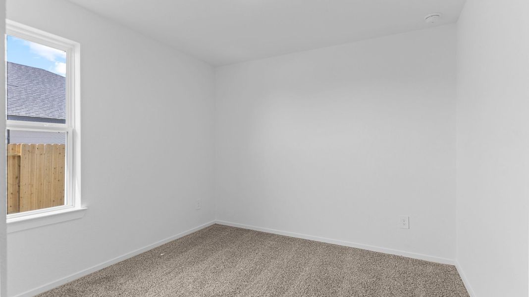 Spacious, unfurnished interior of a new home in Caldwell Crossing, Iowa Colony (Image 14).