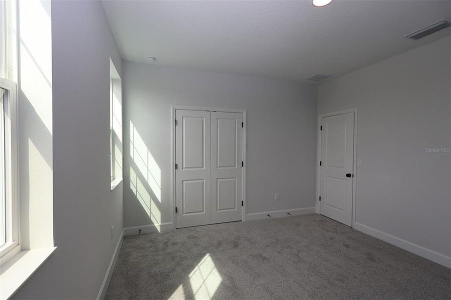 Spacious, unfurnished interior of a new home in Lake Star at Ovation, Winter Garden (Image 23).