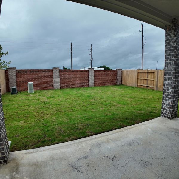 Exterior details and patio area of a home in Wildrye, Waller (Image 3). Exterior details and patio area of a home in Wildrye, Waller (Image 3).