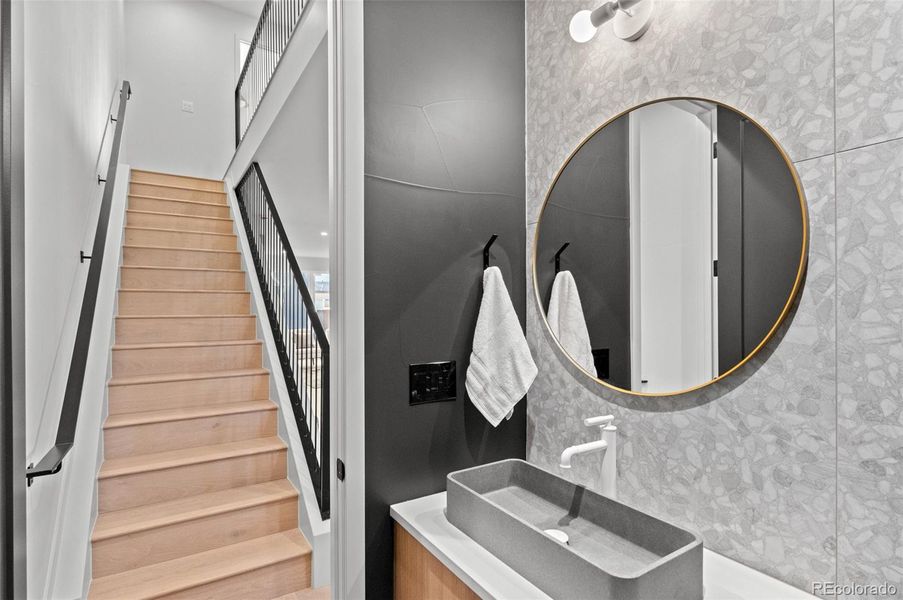 First floor powder room with Terrazzo porcelain accent wall