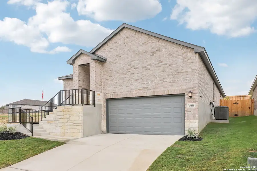 Front exterior of a new home in Comanche Ridge, San Antonio, TX, highlighting curb appeal (Image 20). Front exterior of a new home in Comanche Ridge, San Antonio, TX, highlighting curb appeal (Image 20).