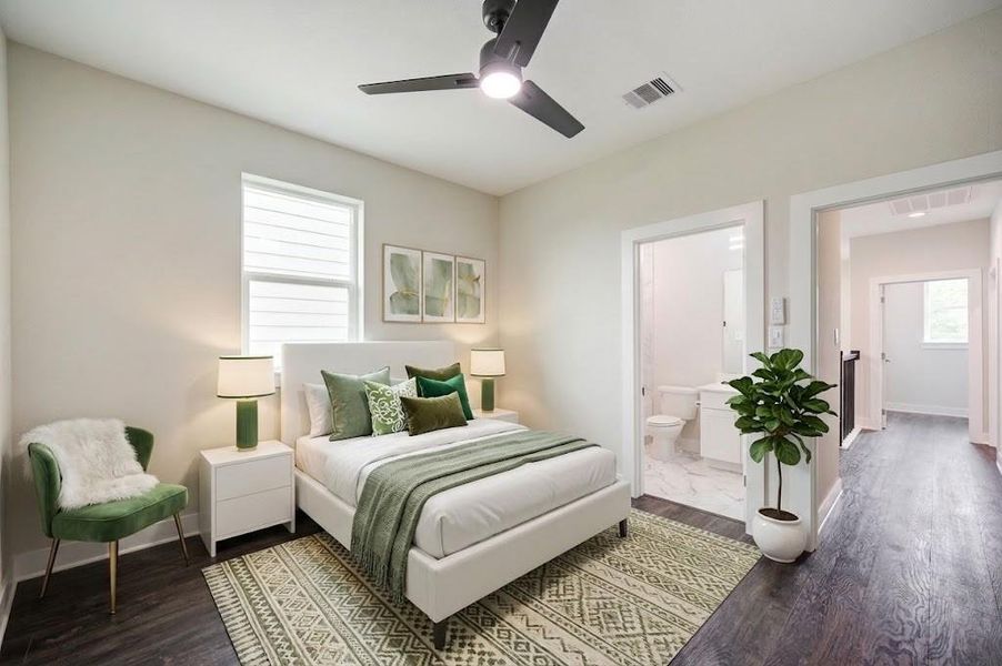 Large third floor bedroom with ceiling fan.
