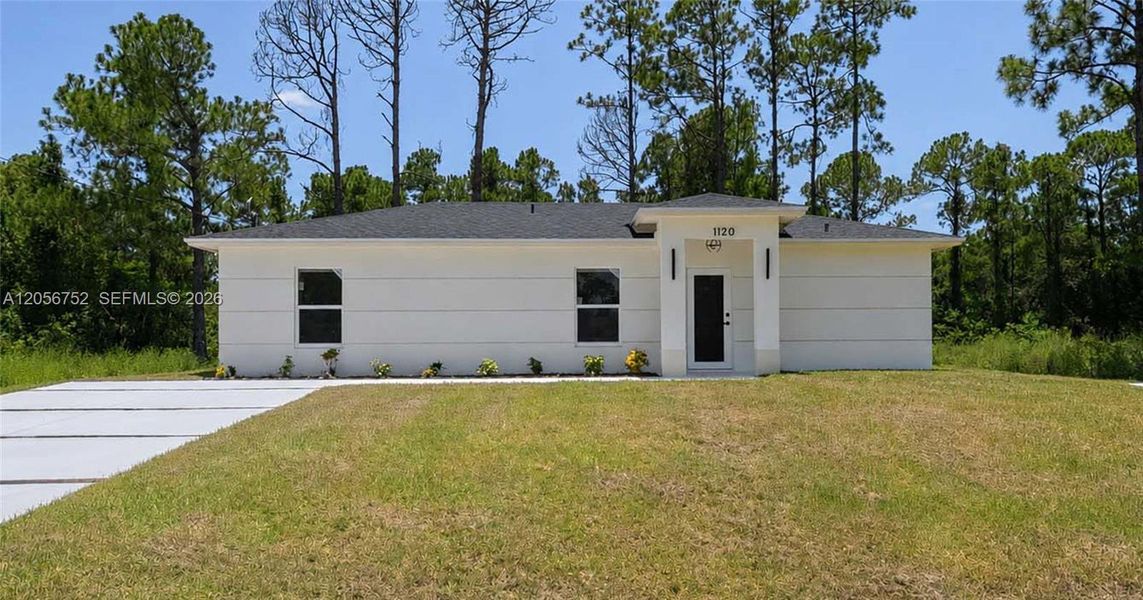 Front exterior of a new home in , Lehigh Acres, FL, highlighting curb appeal (Image 17). Front exterior of a new home in , Lehigh Acres, FL, highlighting curb appeal (Image 17).