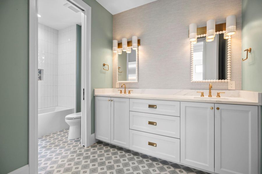 Bathroom with toilet and double vanity