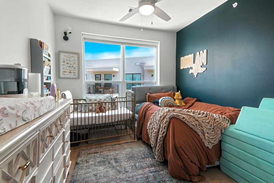 Bedroom featuring wood finished floors and ceiling fan