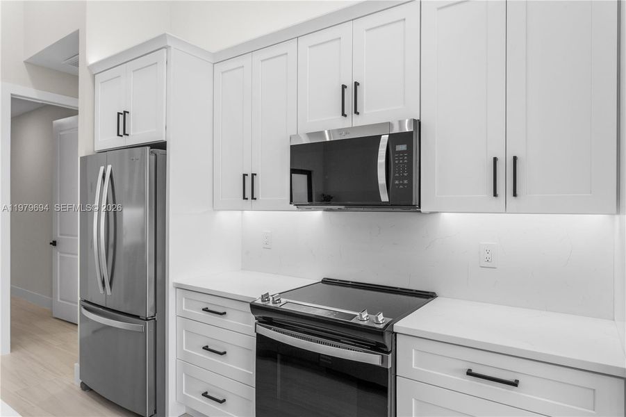 Equipped w/ SS appliances, French-door refrigerator, microwave, smooth-top range & dishwasher. Equipped w/ SS appliances, French-door refrigerator, microwave, smooth-top range & dishwasher.