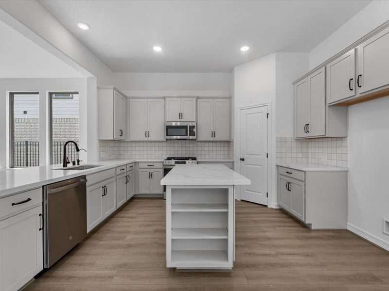 Kitchen. Sample product photo. Actual exterior and interior selections may vary by homesite. Photo may be virtually staged. Kitchen. Sample product photo. Actual exterior and interior selections may vary by homesite. Photo may be virtually staged.