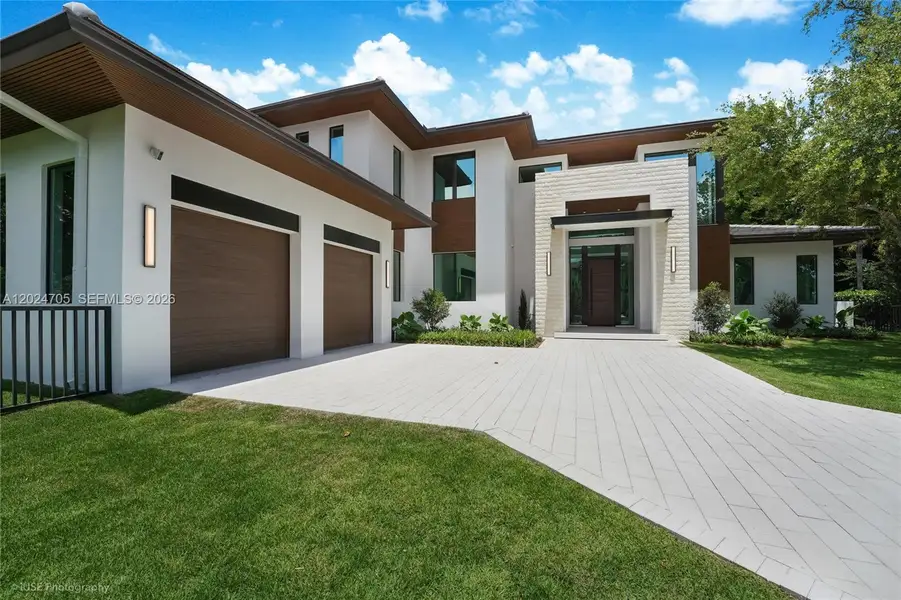 Front exterior of a new home in , Pinecrest, FL, highlighting curb appeal (Image 23).