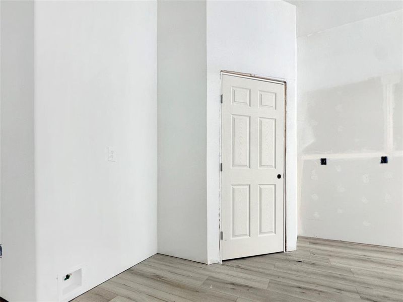 Spare room featuring light wood-type flooring Spare room featuring light wood-type flooring