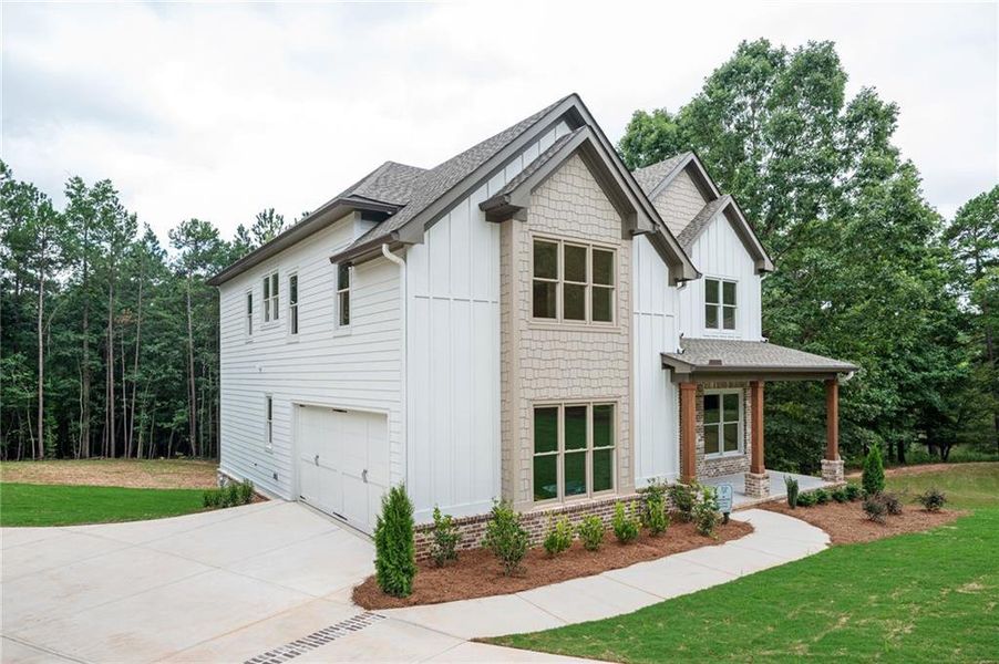 Front exterior of a new home in , Monroe, GA, highlighting curb appeal (Image 26). Front exterior of a new home in , Monroe, GA, highlighting curb appeal (Image 26).