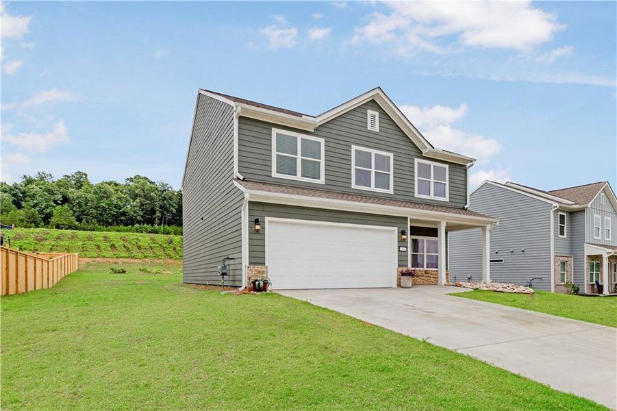 Front exterior of a new home in , Calhoun, GA, highlighting curb appeal (Image 22). Front exterior of a new home in , Calhoun, GA, highlighting curb appeal (Image 22).