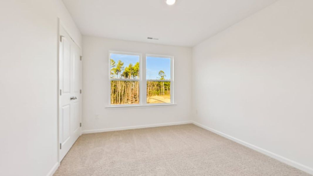 Spacious, unfurnished interior of a new home in Chapel Townes, Raleigh (Image 18).