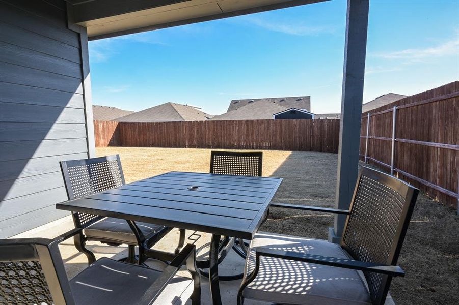 View of patio / terrace with outdoor dining area and a fenced backyard