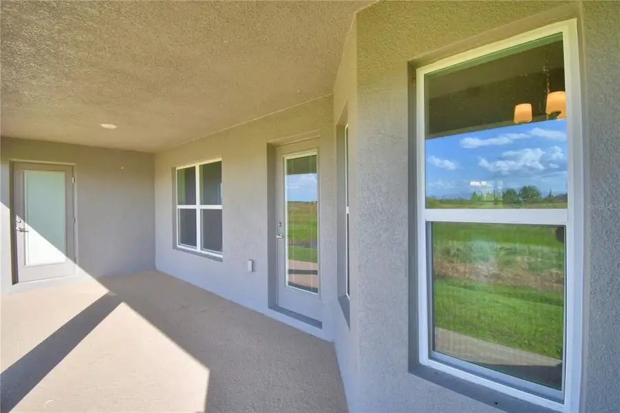 Exterior details and patio area of a home in Cadence Crossing, Auburndale (Image 3).