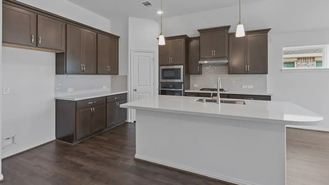 Furnished interior view inside a new home in Sunterra, Katy (Image 14).