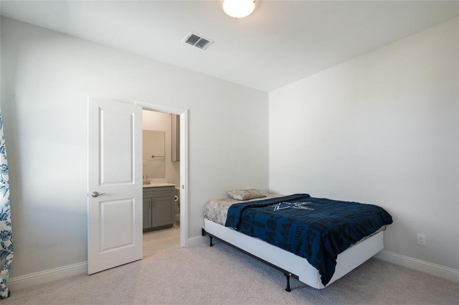 3rd bedroom with ensuite bath and walk in closet.