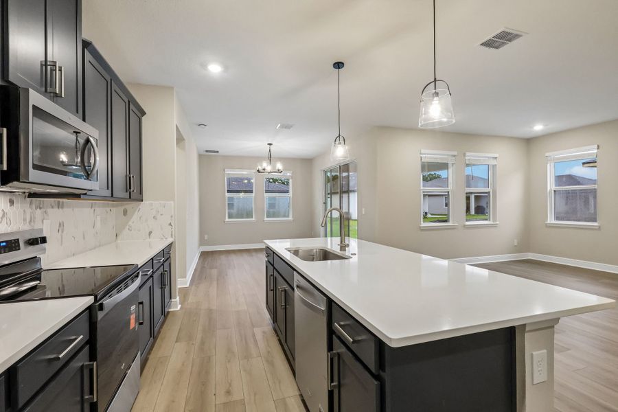 Furnished interior view inside a new home in Legends Preserve - Signature Series, Daytona Beach (Image 4).