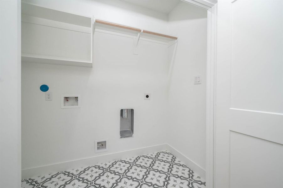 Laundry room setup ready for washer and dryer installation with convenient built-in connections.