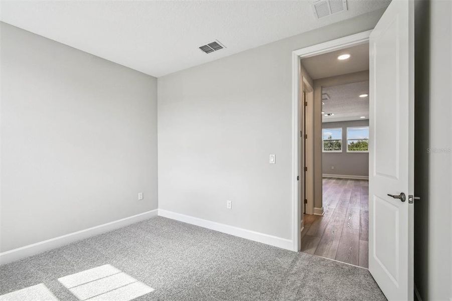 Spacious, unfurnished interior of a new home in Solace at Corner Lake, Orlando (Image 23).