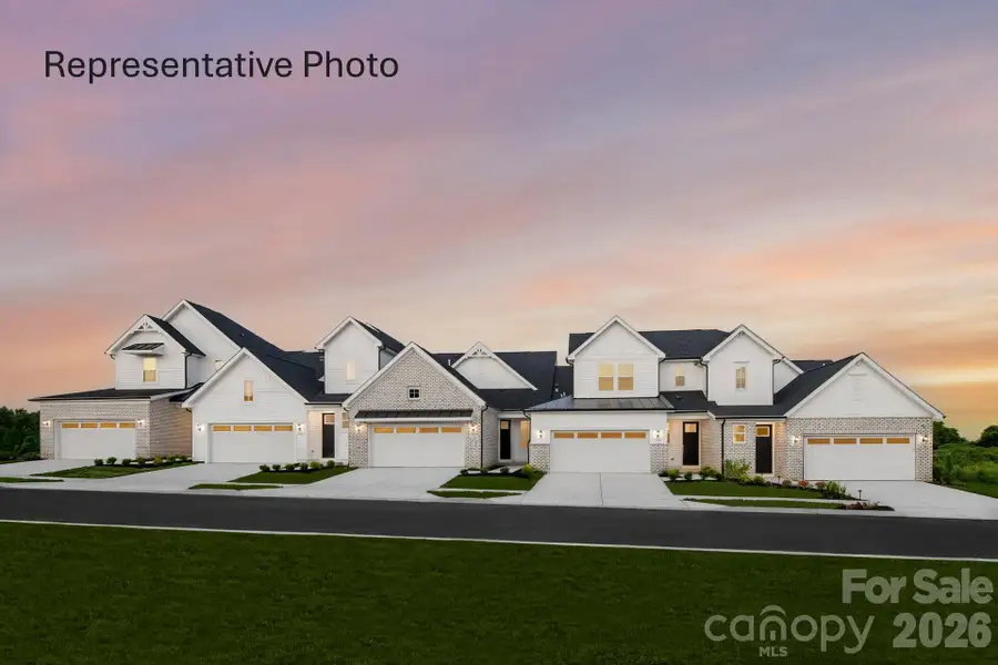 Front exterior of a new home in Brook Run Villas, Fort Mill, SC, highlighting curb appeal (Image 1). Front exterior of a new home in Brook Run Villas, Fort Mill, SC, highlighting curb appeal (Image 1).