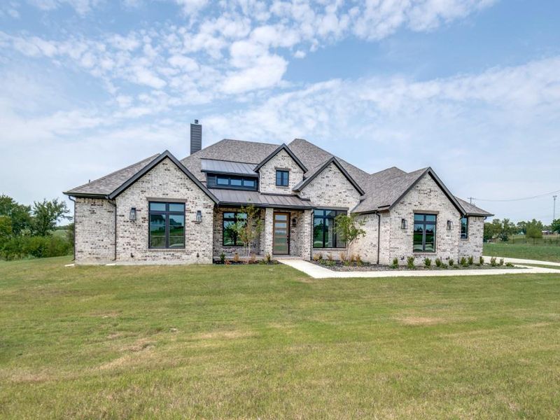 Front exterior of a new home in , Mesquite, TX, highlighting curb appeal (Image 1).