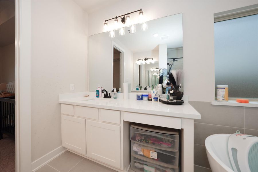 Furnished interior view inside a new home in Elyson, Katy (Image 39).