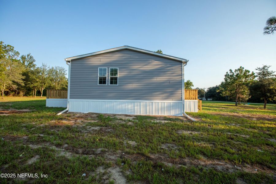 Front exterior of a new home in , Keystone Heights, FL, highlighting curb appeal (Image 30). Front exterior of a new home in , Keystone Heights, FL, highlighting curb appeal (Image 30).
