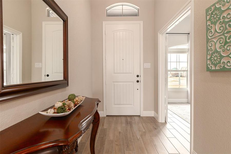 Beautful wide entry with wood like tile through out all living areas