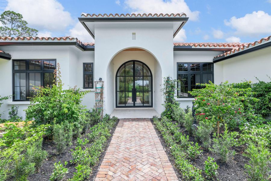 Front exterior of a new home in , Wellington, FL, highlighting curb appeal (Image 21).