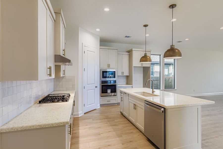Furnished interior view inside a new home in 6 Creeks, Kyle (Image 3).