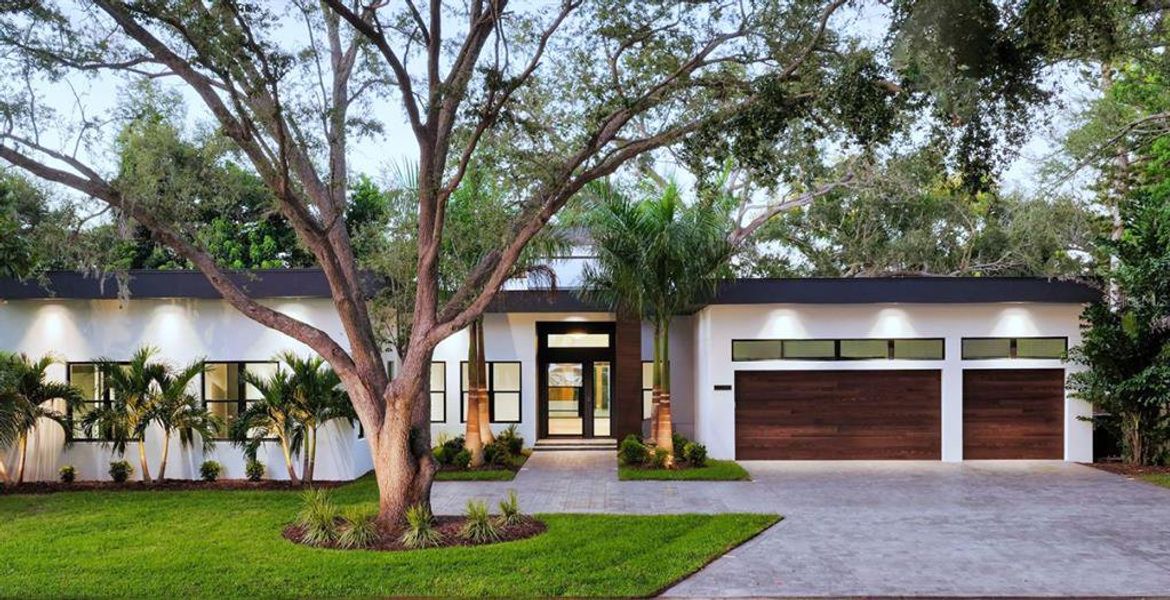 Front exterior of a new home in , Sarasota, FL, highlighting curb appeal (Image 1). Front exterior of a new home in , Sarasota, FL, highlighting curb appeal (Image 1).