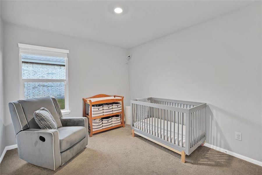 Secondary bedroom makes for a spacious nursery that little ones can grow into.