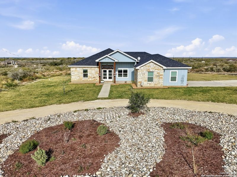Front exterior of a new home in , Uvalde, TX, highlighting curb appeal (Image 21). Front exterior of a new home in , Uvalde, TX, highlighting curb appeal (Image 21).