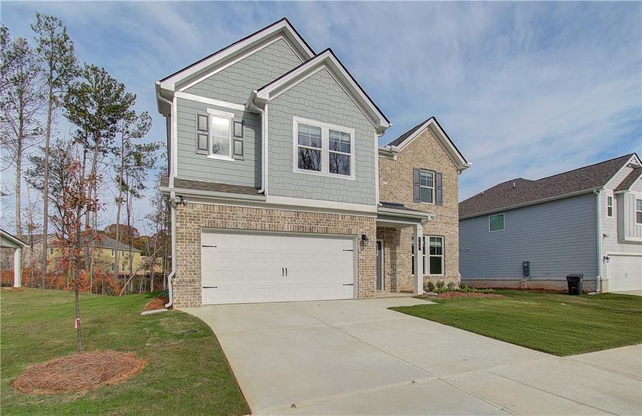 Front exterior of a new home in Westminster, Covington, GA, highlighting curb appeal (Image 17).