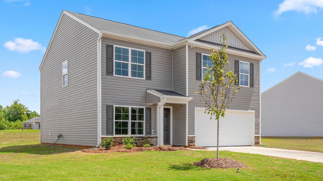 Front exterior of a new home in Mount Hope Estates, Winston-Salem, NC, highlighting curb appeal (Image 16). Front exterior of a new home in Mount Hope Estates, Winston-Salem, NC, highlighting curb appeal (Image 16).
