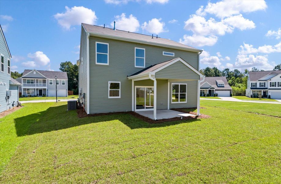 Front exterior of a new home in Oakley Pointe, Moncks Corner, SC, highlighting curb appeal (Image 26).