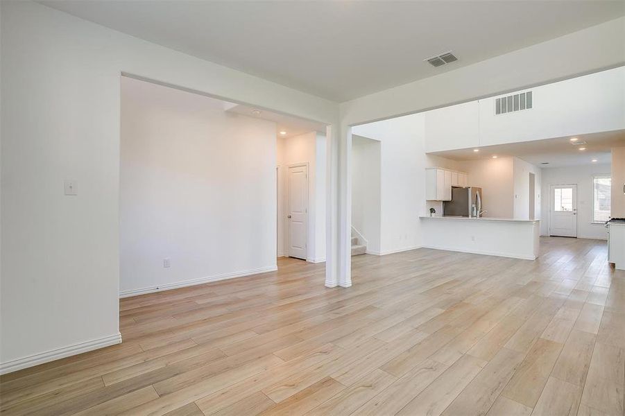 Unfurnished living room with light wood-type flooring