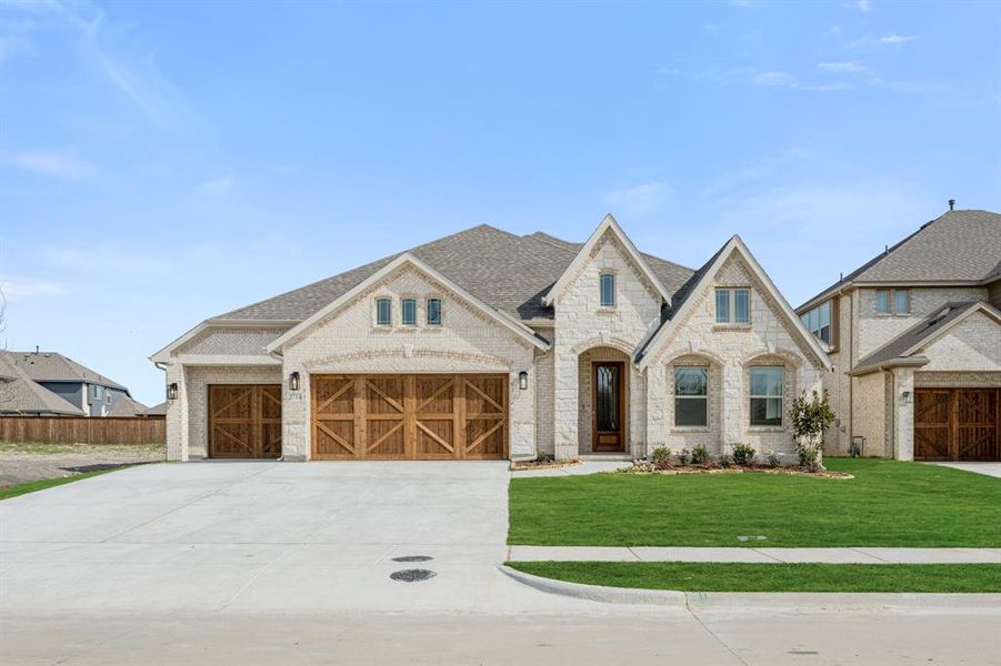 Front exterior of a new home in Terracina, Rockwall, TX, highlighting curb appeal (Image 25).