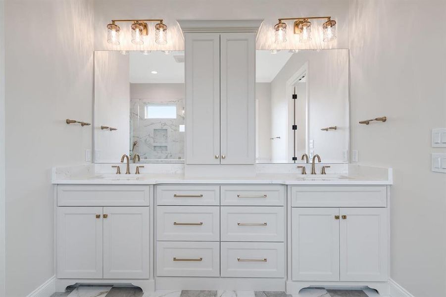 Full bathroom with a marble finish shower and double vanity Full bathroom with a marble finish shower and double vanity