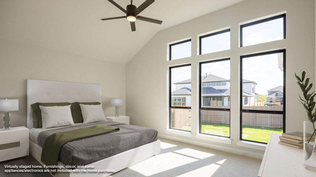 Bedroom featuring carpet floors, a ceiling fan, and high vaulted ceiling