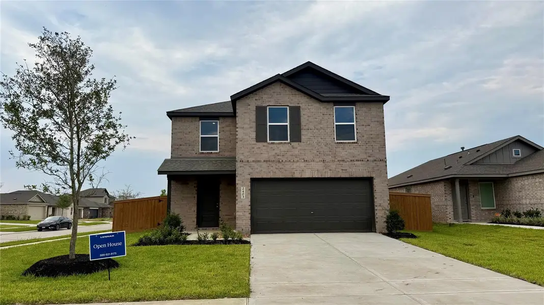 Front exterior of a new home in Canterra Creek: Cottage Collection, Rosharon, TX, highlighting curb appeal (Image 1).
