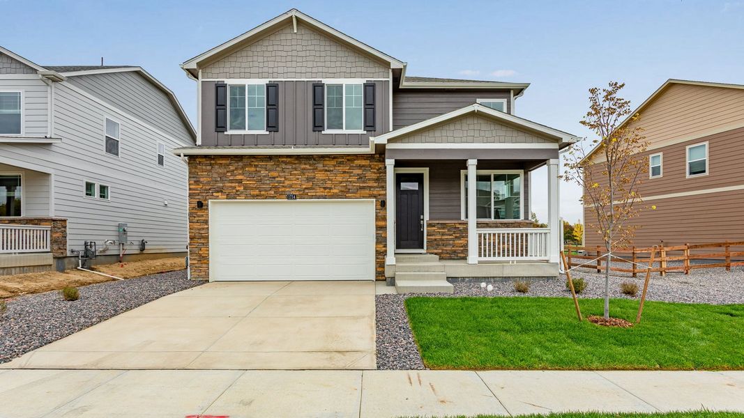 Front exterior of a new home in Silver Peaks, Lochbuie, CO, highlighting curb appeal (Image 1). Front exterior of a new home in Silver Peaks, Lochbuie, CO, highlighting curb appeal (Image 1).