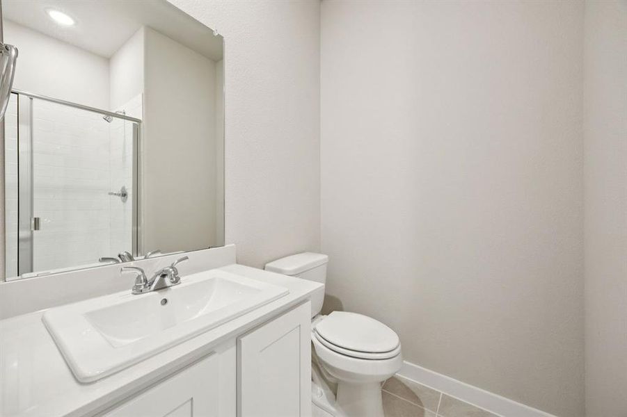 Bathroom in the Oscar home plan by Trophy Signature Homes – REPRESENTATIVE PHOTO