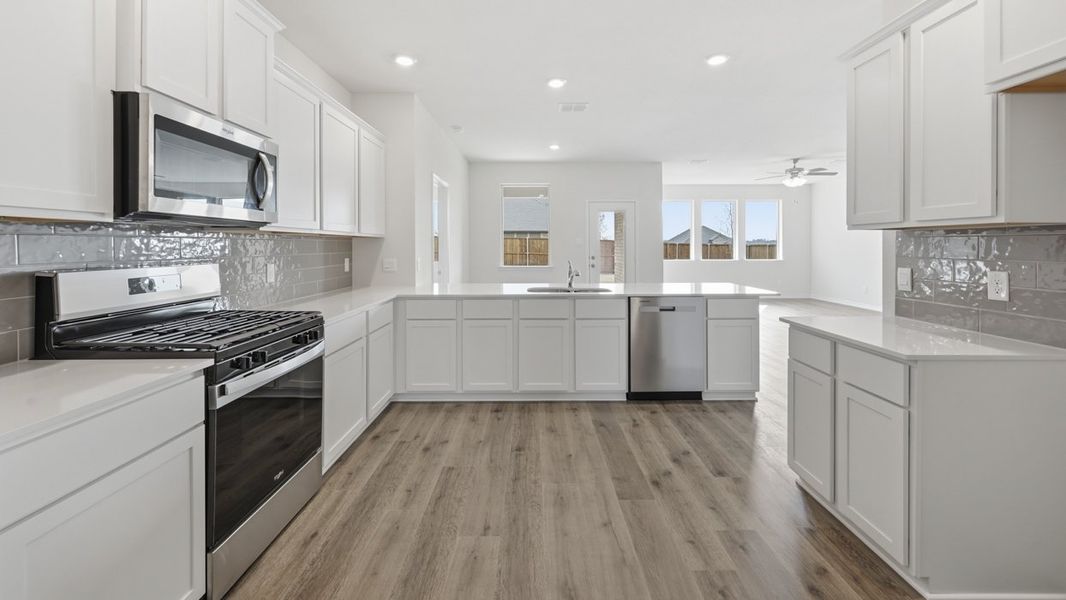 Representative furnished interior of a home built from the H204 Medbourne by D.R. Horton in Lilybrooke at Legacy Hills, Celina (Image 4).