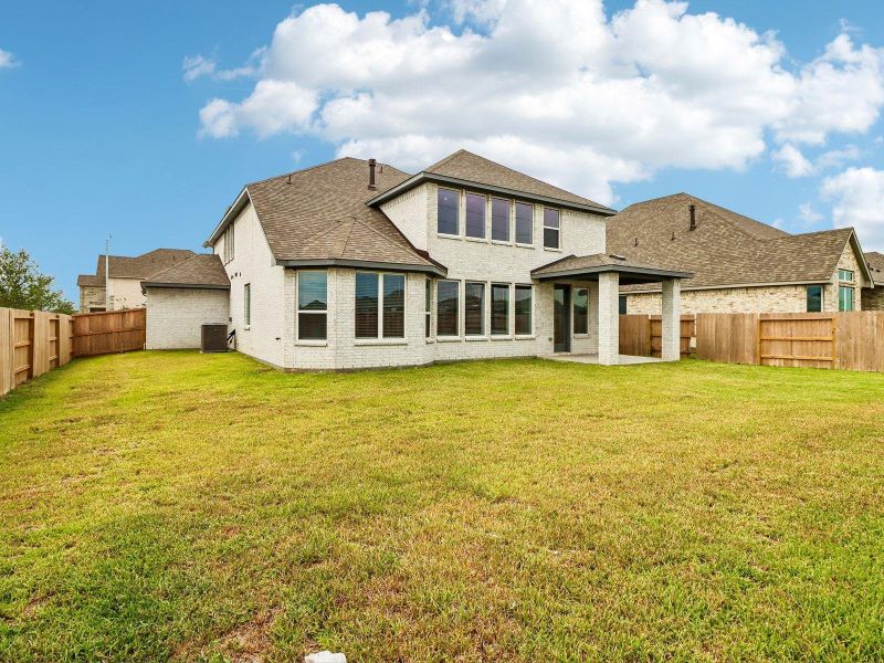 Exterior details and patio area of a home in Massey Oaks - Estate Series, Pearland (Image 25).