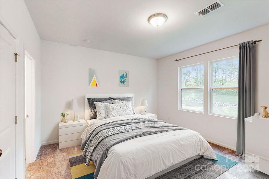 Secondary bedroom shown with virtual staging