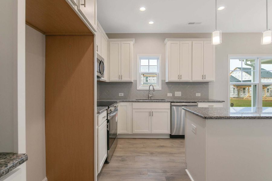 Representative furnished interior of a home built from the Magnolia by Caviness & Cates Communities in Bartlett Manor, Youngsville (Image 162).