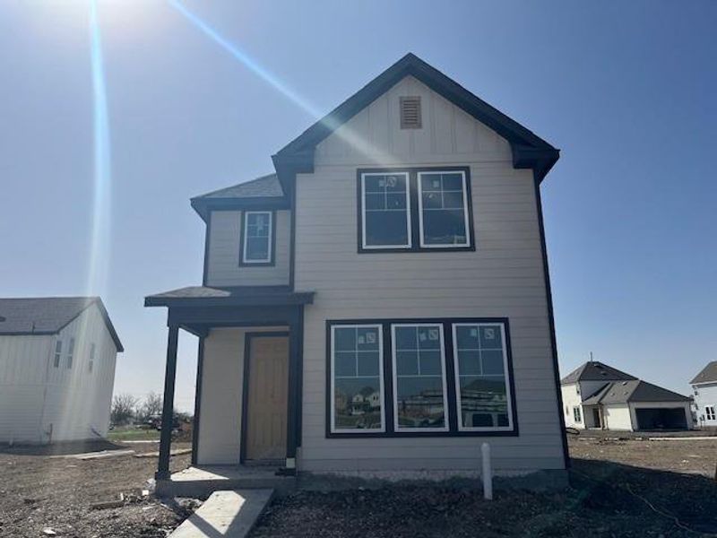 View of front facade with board and batten siding