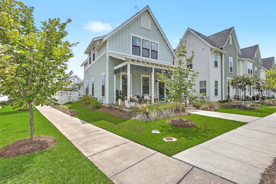 Front exterior of a new home in Nexton - Midtown, Summerville, SC, highlighting curb appeal (Image 25). Front exterior of a new home in Nexton - Midtown, Summerville, SC, highlighting curb appeal (Image 25).